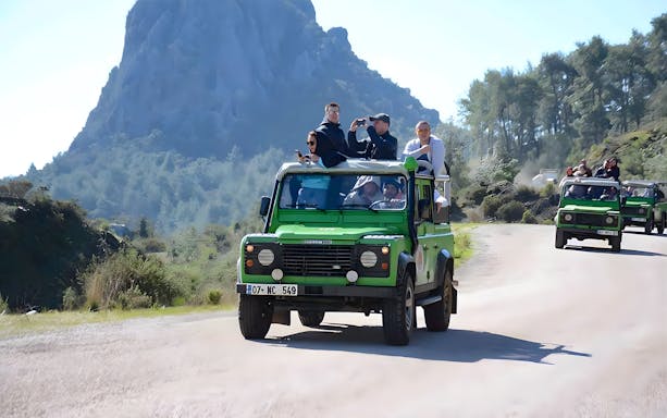 Tourists on a jeep safari exploring the scenic landscape near Kekova Sunken City, Demre.
