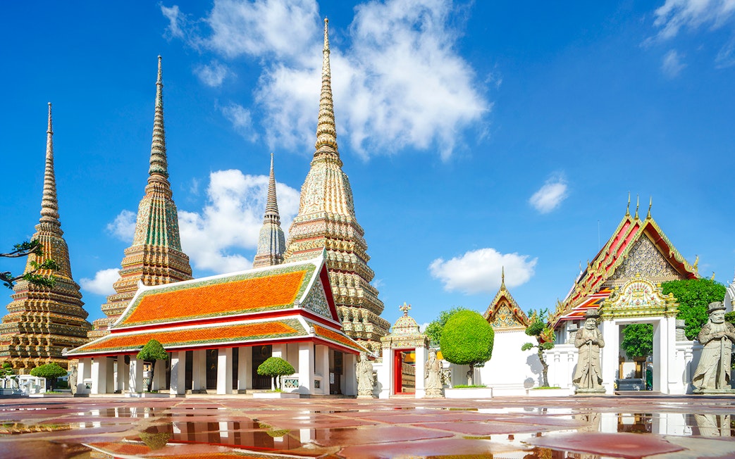 Wat Pho temple complex with ornate spires and traditional architecture in Bangkok.