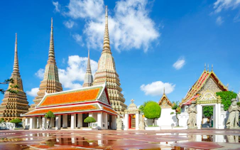 Wat Pho temple complex with ornate spires and traditional architecture in Bangkok.