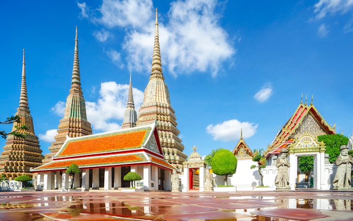 Wat Pho temple complex with ornate spires and traditional architecture in Bangkok.