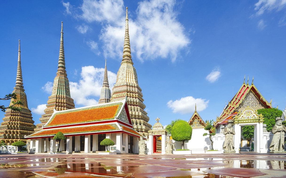 Wat Pho temple complex with ornate spires and traditional architecture in Bangkok.