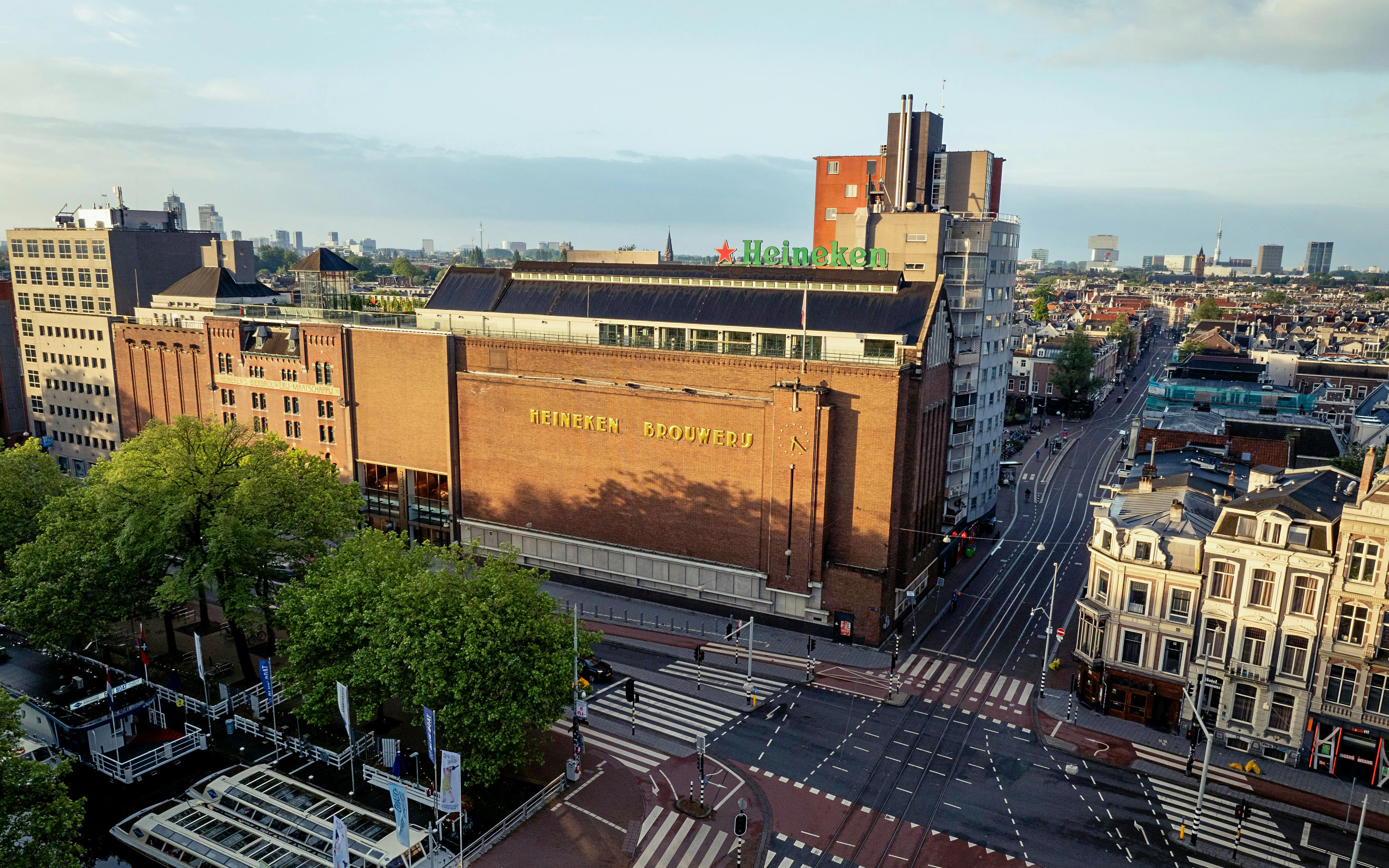 Heineken Brewery building in Amsterdam, view from above with cityscape.