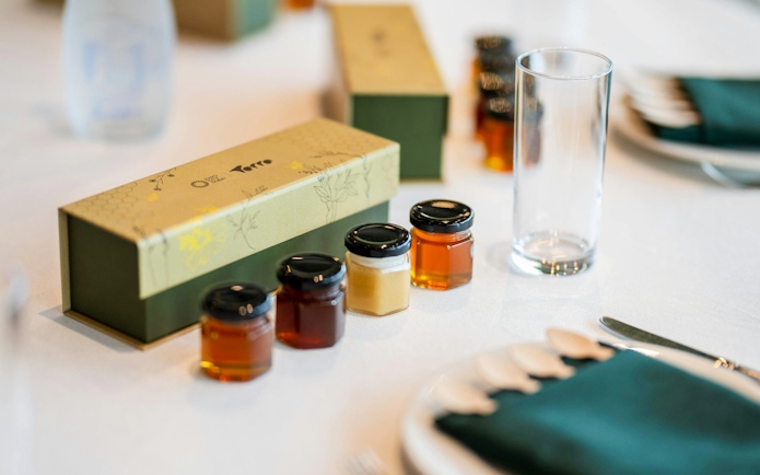 Samples of honey in small jars at A Taste of the Hive, Expo City Dubai.