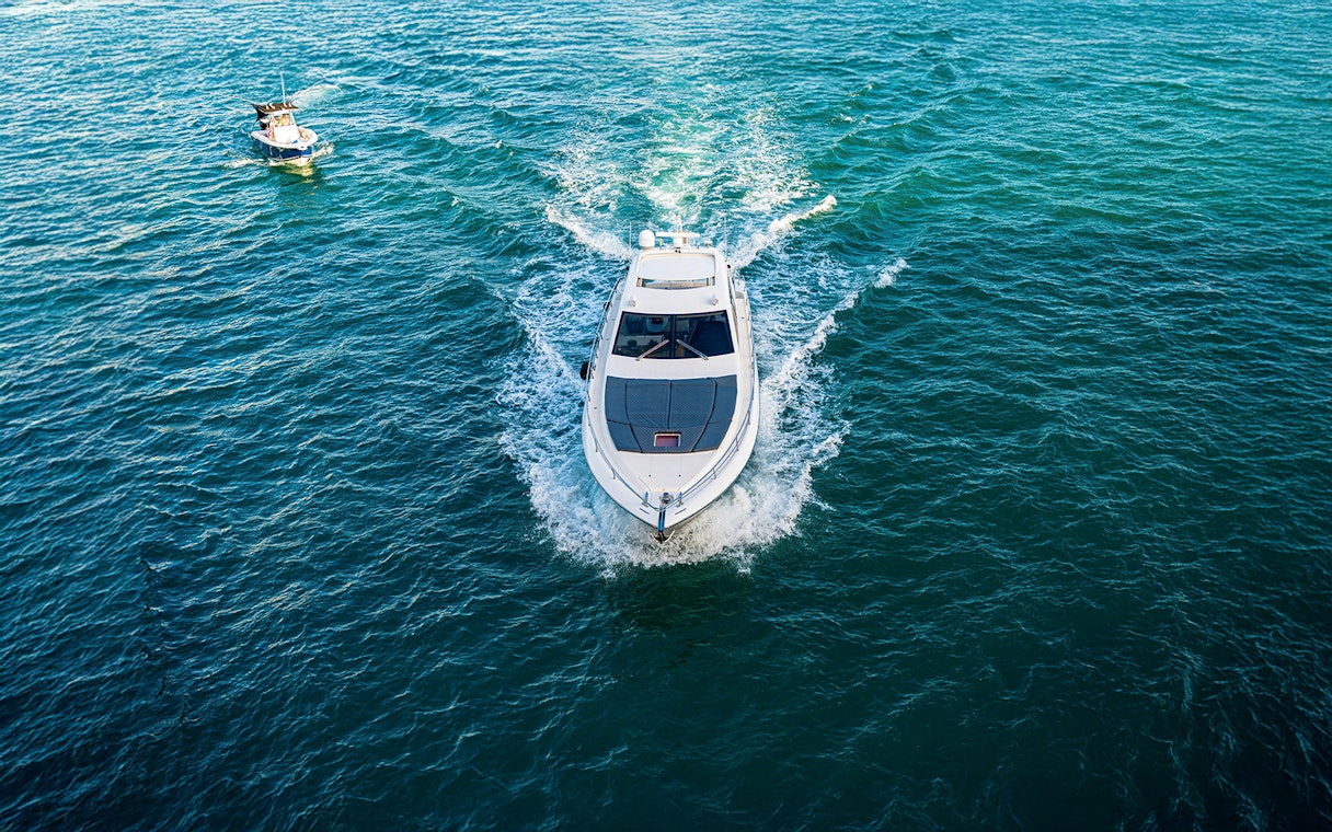 Boat cruising on Biscayne Bay during a South Beach sunset tour.