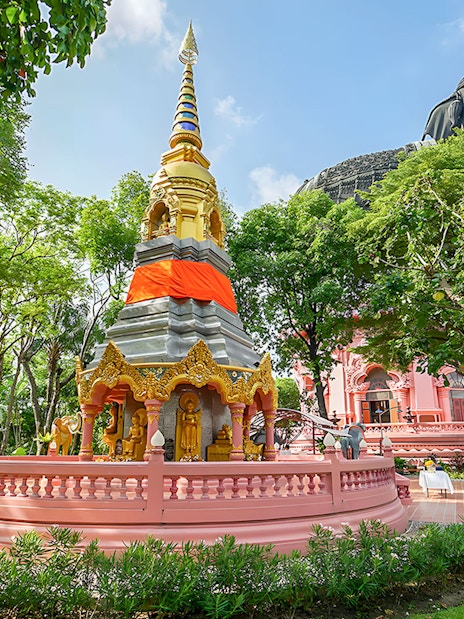 Erawan Museum's three-headed elephant statue and ornate stupa in Bangkok's Ancient City.