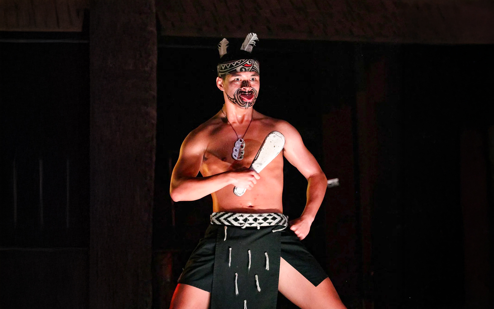 Traditional Polynesian dancer performing at Germaine's Luau.