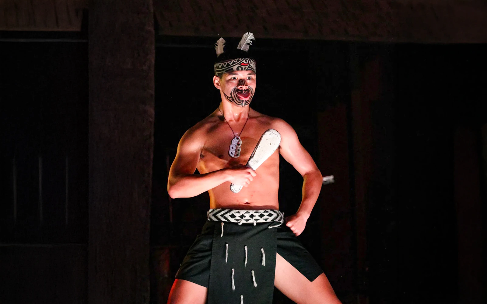Traditional Polynesian dancer performing at Germaine's Luau.