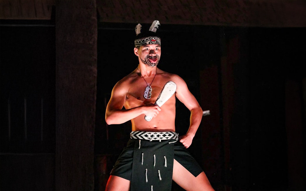Traditional Polynesian dancer performing at Germaine's Luau.
