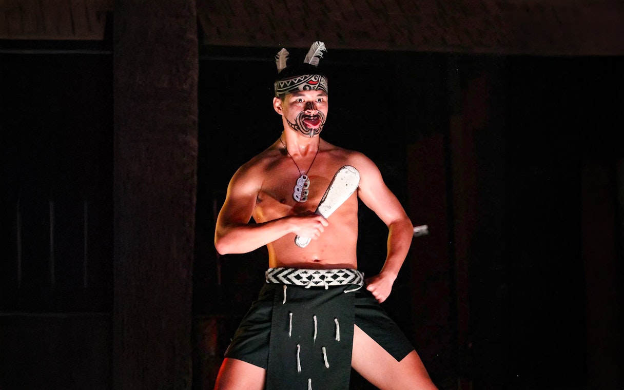 Traditional Polynesian dancer performing at Germaine's Luau.