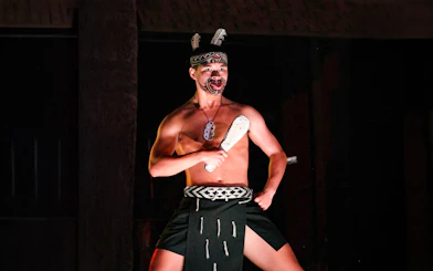 Traditional Polynesian dancer performing at Germaine's Luau.