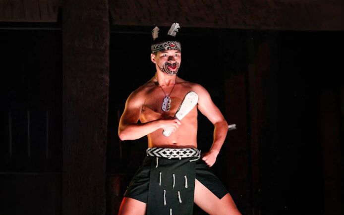 Traditional Polynesian dancer performing at Germaine's Luau.