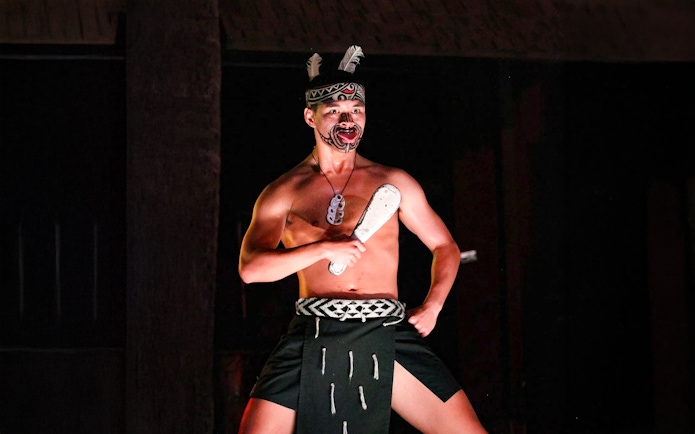 Traditional Polynesian dancer performing at Germaine's Luau.