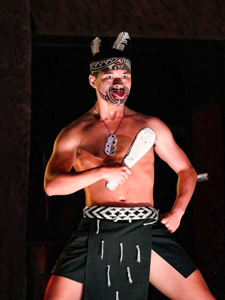 Traditional Polynesian dancer performing at Germaine's Luau.