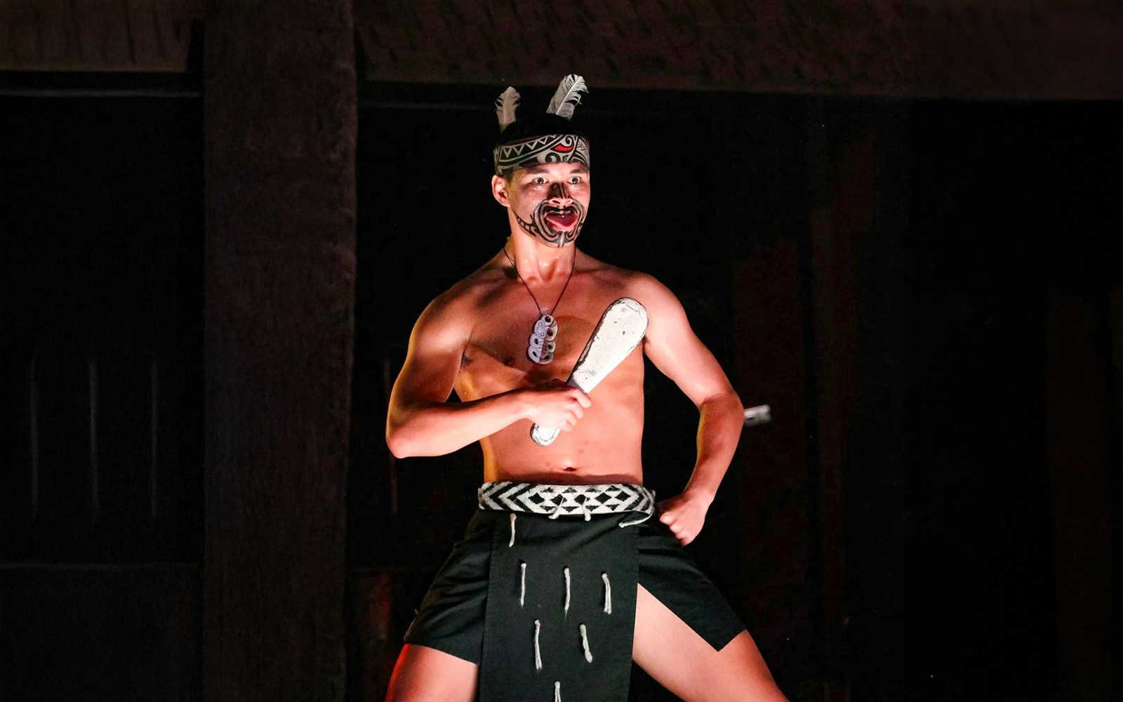 Traditional Polynesian dancer performing at Germaine's Luau.