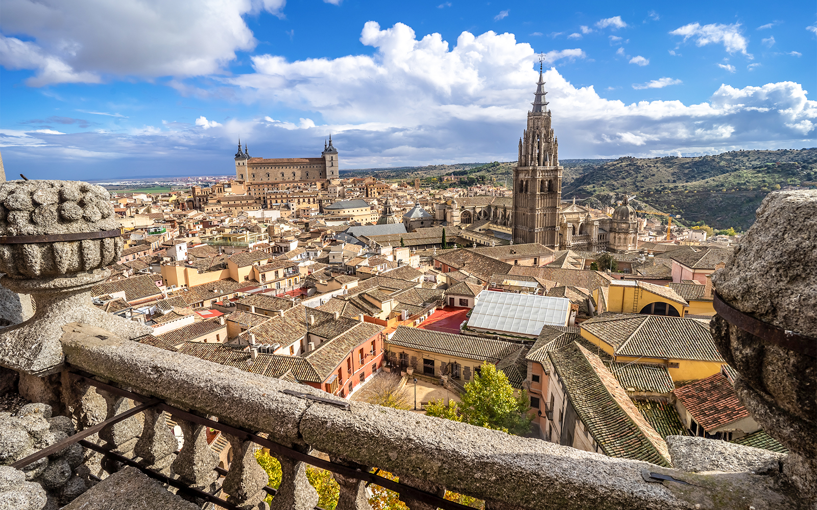 Toledo History Center exterior with visitors exploring the historic architecture in Toledo, Spain.