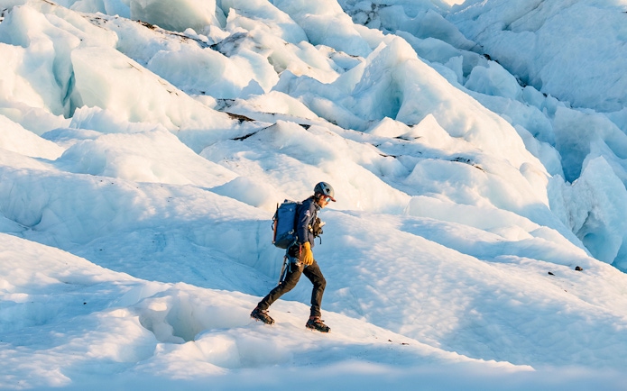 Hiker traversing Vatnajökull glacier in Iceland.