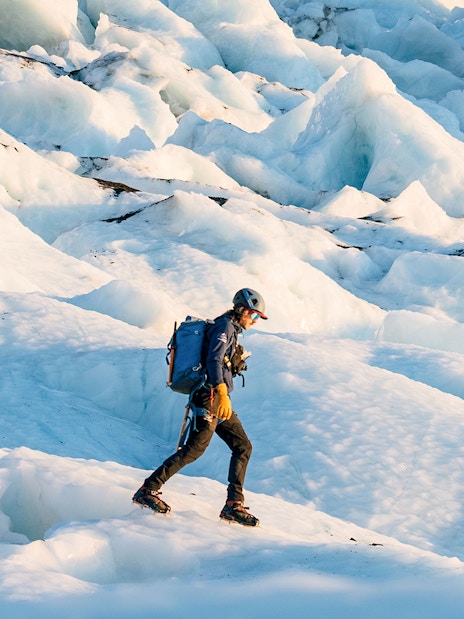 Hiker traversing Vatnajökull glacier in Iceland.