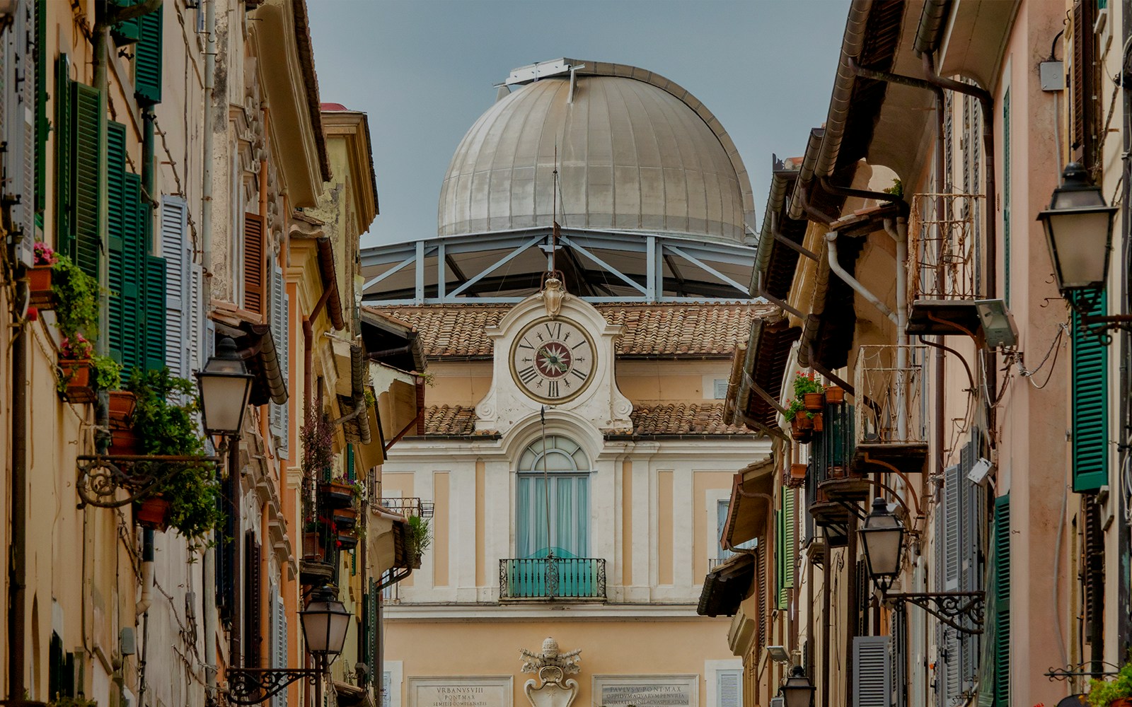 Vatican Observatory dome at Castel Gandolfo with scenic view of surrounding landscape.