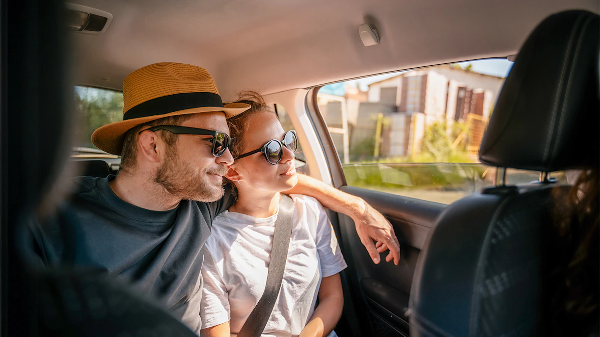 Couple enjoying private car transfer