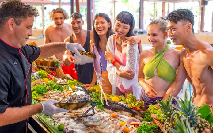 Chef preparing seafood for guests at Andamanda Phuket Water Park.
