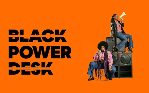 Two people with microphones and speakers, representing Black Power Desk.