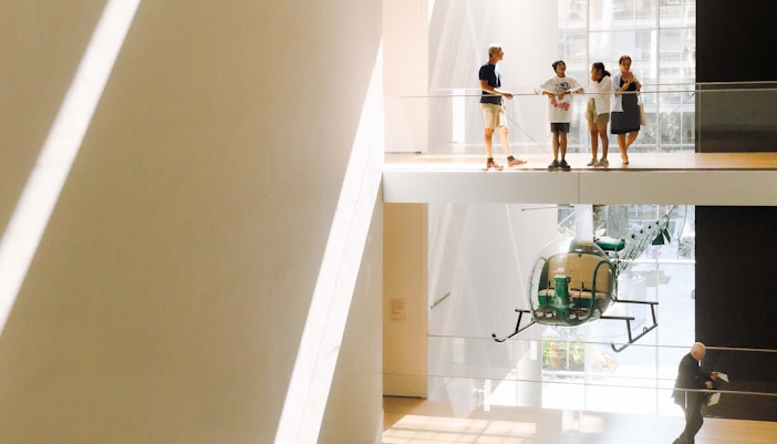 Atrium view of MoMA in New York City showcasing modern art installations.