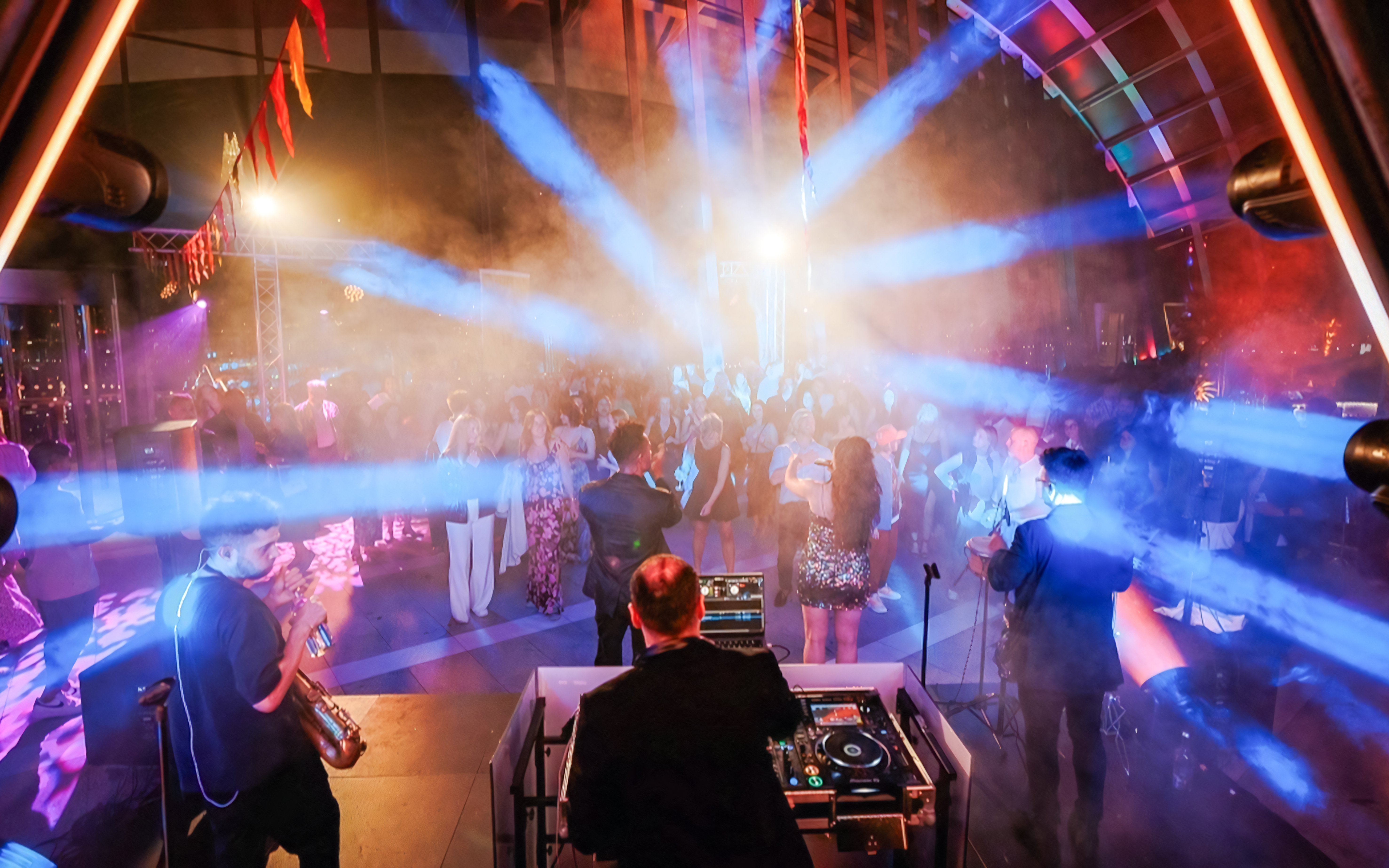 DJ and live band performing at Music Night, Sky Garden London, with a vibrant crowd.