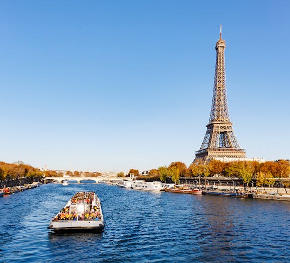 River cruise near Eiffel Tower, Paris, part of London to Paris tours.