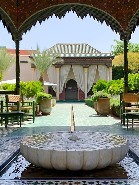 Fountain and garden view at Le Jardin Secret, Marrakech, Morocco.