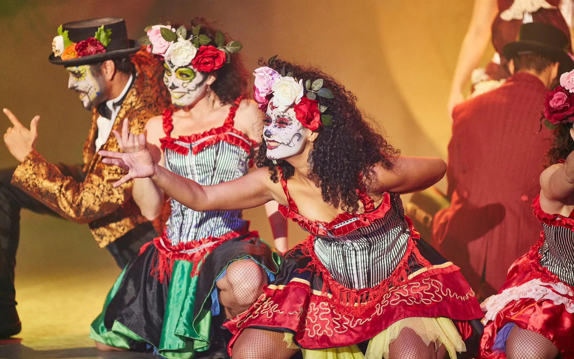Performers in Day of the Dead costumes at PortAventura Park Halloween event.