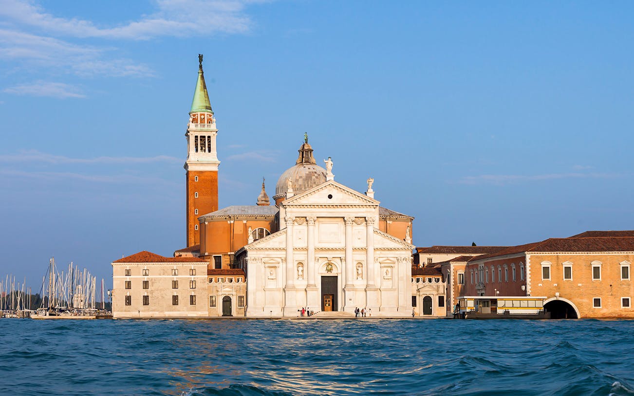 Giorgio Cini Foundation with San Giorgio Maggiore Church in Venice, Italy, viewed from the water.