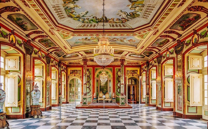 National Palace of Queluz Ambassadors Room with ornate ceiling and chandeliers.