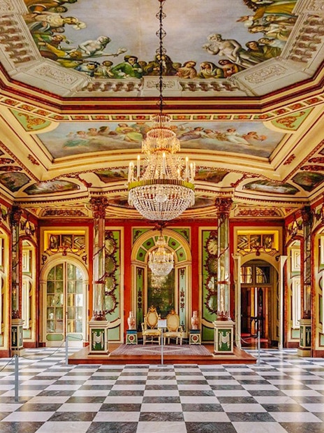 National Palace of Queluz Ambassadors Room with ornate ceiling and chandeliers.
