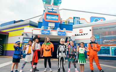 Children in costumes outside Galacticoaster at Brick or Treat, Legoland Florida.