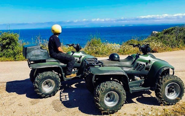 Person on quad bike overlooking the sea in Santa Teresa di Gallura.