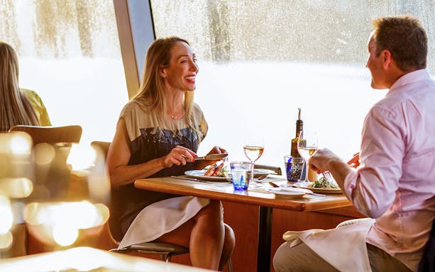 Couple dining on a Sydney Harbour dinner cruise.