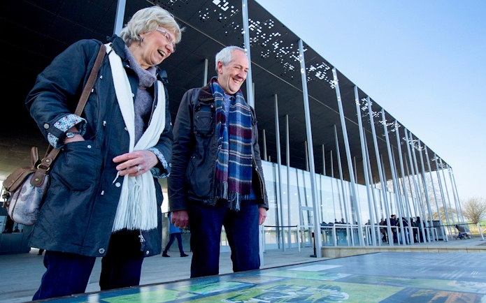Visitors at Stonehenge visitor center during London to Stonehenge and Bath day trip.