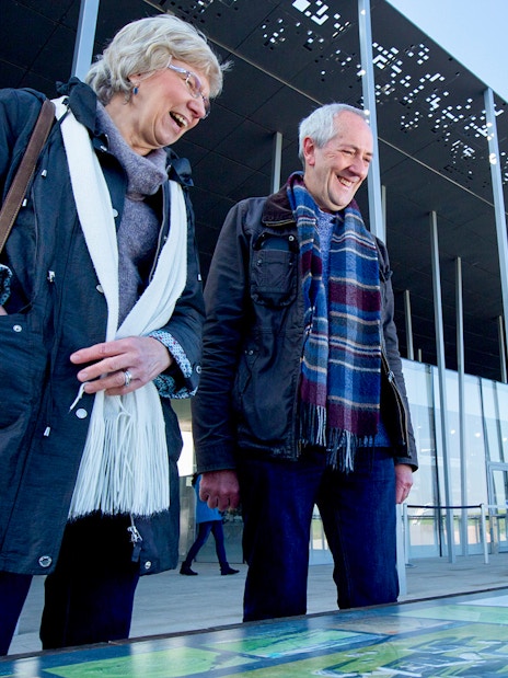 Visitors at Stonehenge visitor center during London to Stonehenge and Bath day trip.