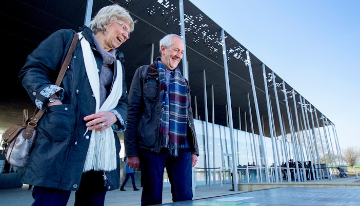 Visitors at Stonehenge visitor center during London to Stonehenge and Bath day trip.