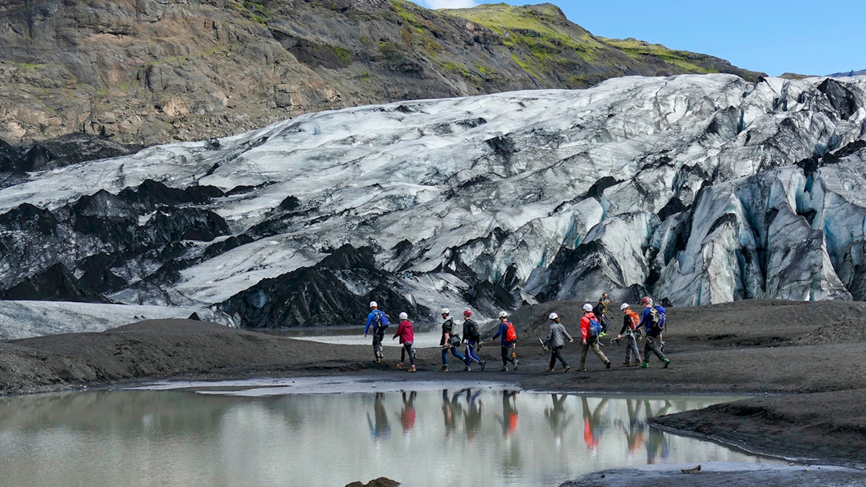 Group hiking near Sólheimajökull Glacier on South Coast Half Day Tour.