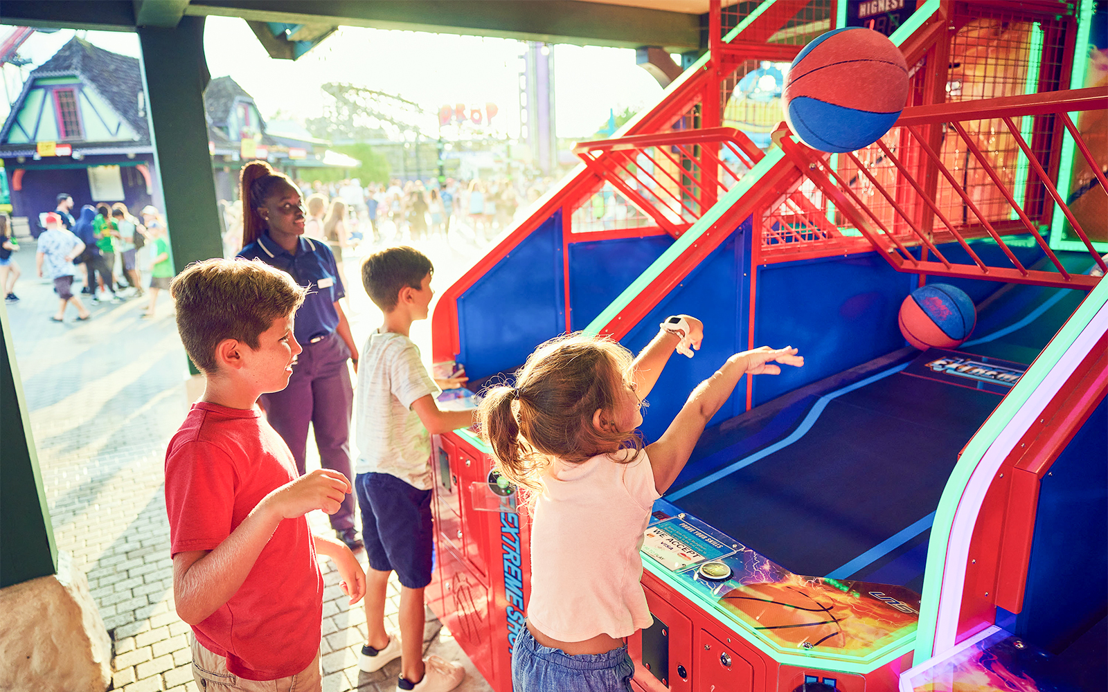 Children playing basketball arcade game at Canada's Wonderland.
