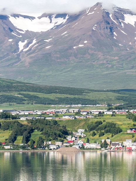 Akureyri cityscape with mountains across Eyjafjordur, Iceland.