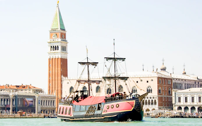 Galleon sailing past St. Mark's Campanile in Venice during dinner cruise.