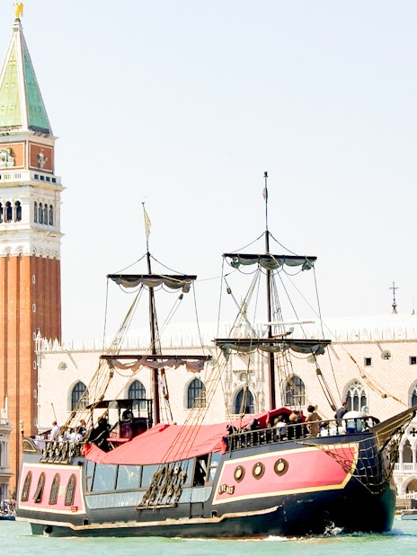 Galleon sailing past St. Mark's Campanile in Venice during dinner cruise.
