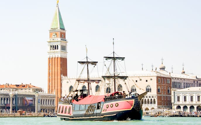 Galleon sailing past St. Mark's Campanile in Venice during dinner cruise.