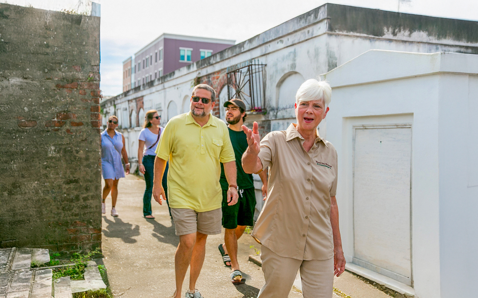 Tour guide leading guests through St. Louis Cemetery in New Orleans.