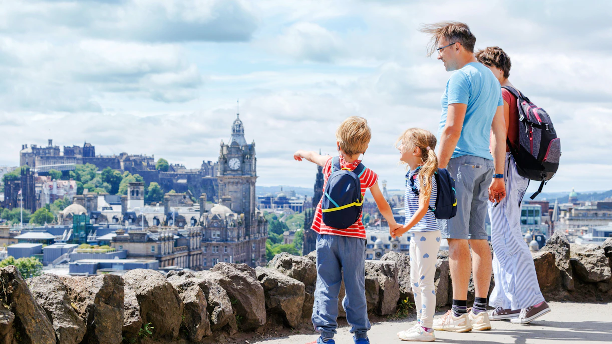 Family with kids enjoys scenic city of Edinburgh skyline view