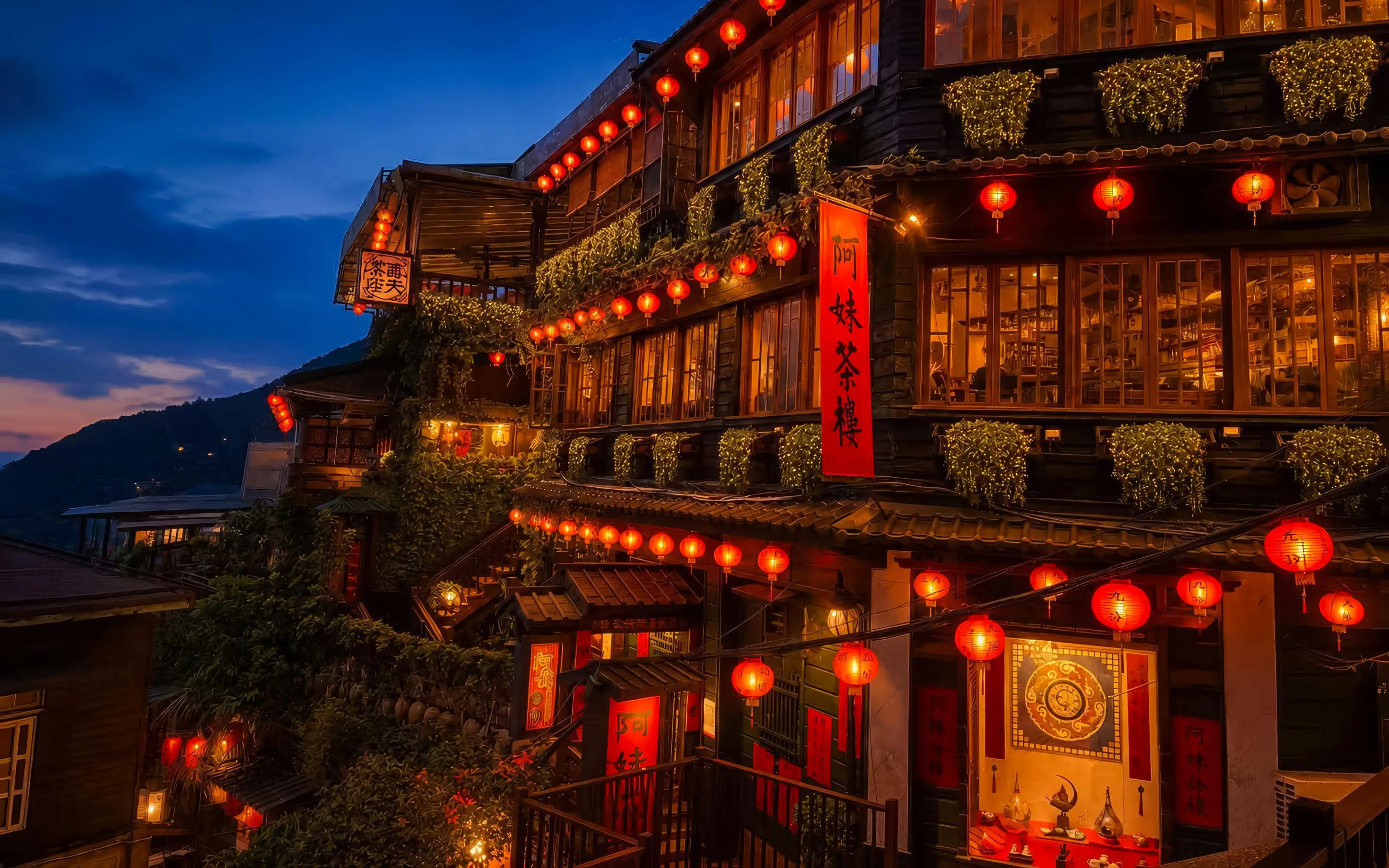 Red lantern-lit buildings in Jiufen, New Taipei City, Taiwan, at dusk.