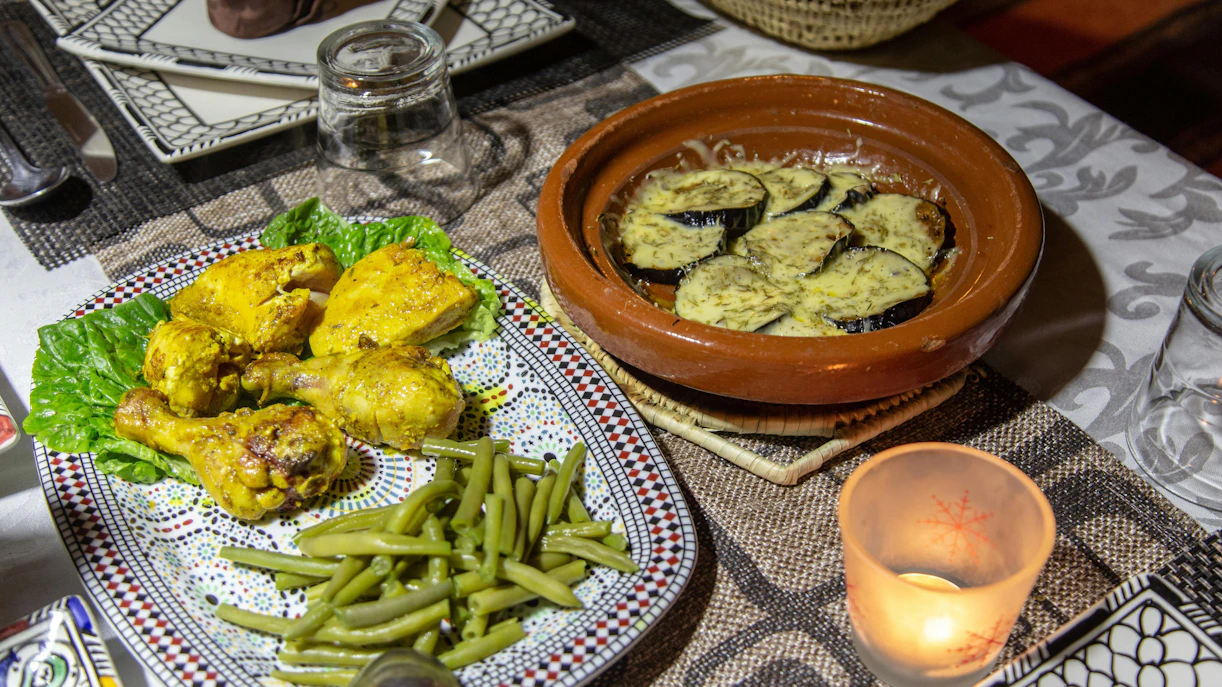 Chicken and green beans with eggplant tagine at desert camp dinner.