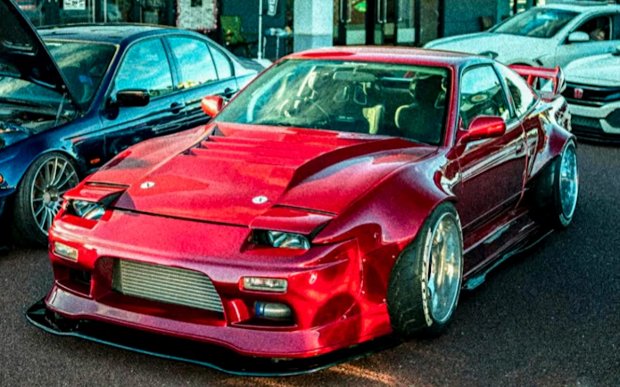 Red sports car at Daikoku PA Car Meeting in Tokyo.